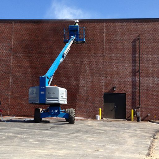 Washing walls Cherry picker cleaning external walls"